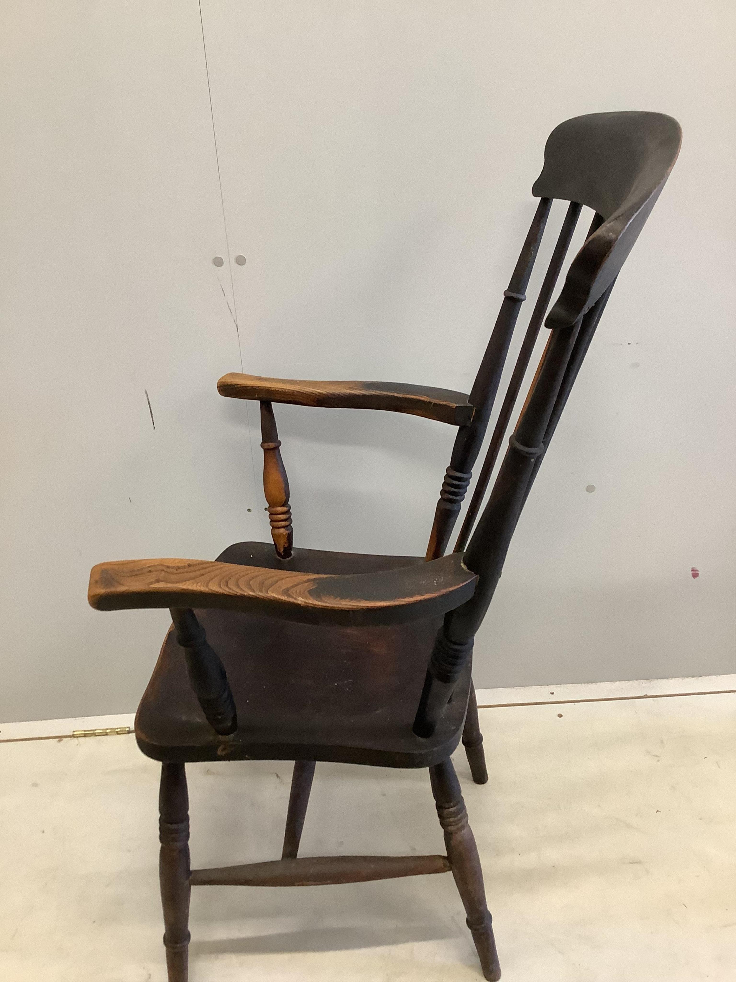 Two Victorian elm and beech Windsor comb back armchairs, larger width 58cm, depth 43cm, height 111cm